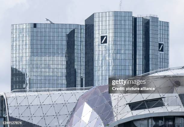 March 2023, Hesse, Frankfurt/Main: Deutsche Bank towers over the houses in Frankfurt's city center. Photo: Boris Roessler/dpa