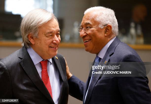Secretary-General António Guterres talks with Portugal's Prime Minister Antonio Costa as they attend a EU Summit, at the EU headquarters in Brussels,...