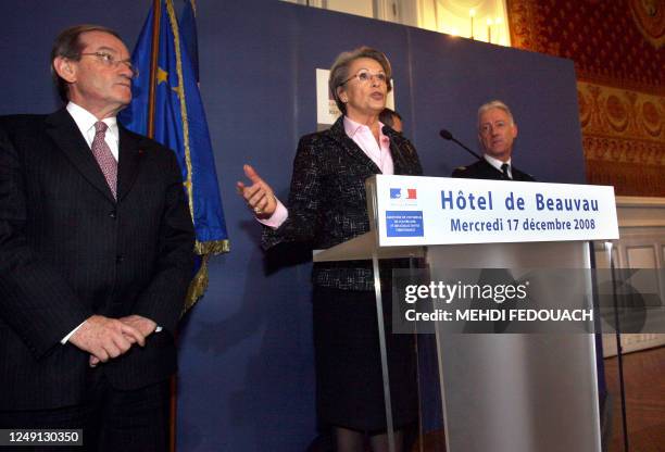 French Interior Minister Michele Alliot-Marie gives a press conference flanked by police prefect Michel Gaudin and Gendarmerie National's director...