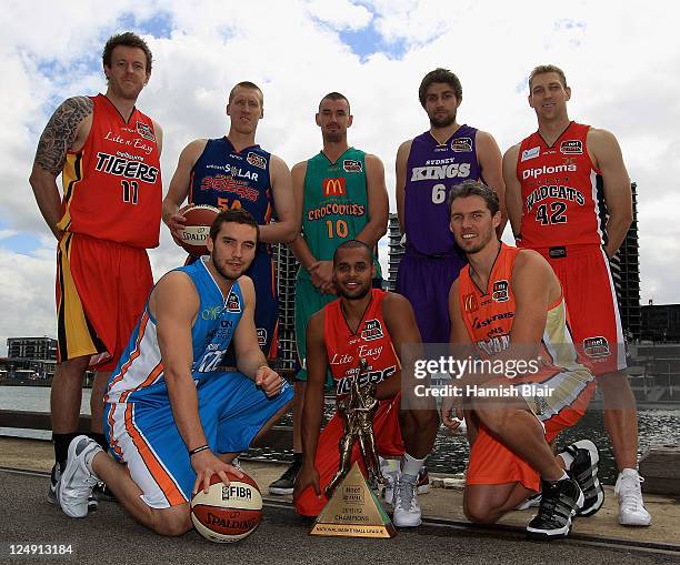 Cameron Tragardh of the Melbourne Tigers, Adam Ballinger of the Adelaide 36ers, Russell Hinder of the Townsville Crocodiles, Julian Khazzouh of the...