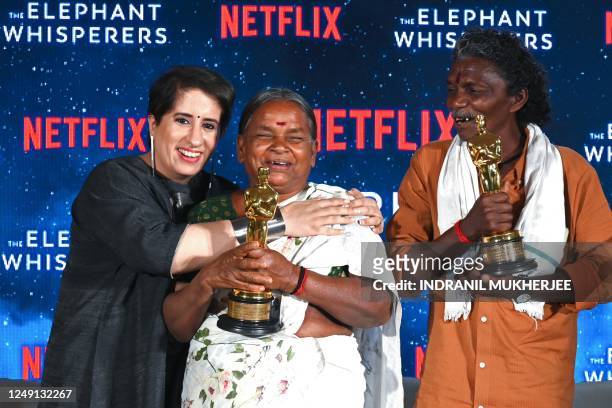 Indian film producer Guneet Monga with protagonists of Oscar winning Documentary short "The Elephant Whisperers" Bellie and Bomman pose with Oscar...