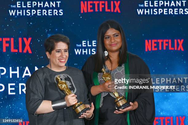 Indian film producer Guneet Monga and filmmaker Kartiki Gonsalves pose with Oscar for Best Documentary Short "The Elephant Whisperers" during a press...