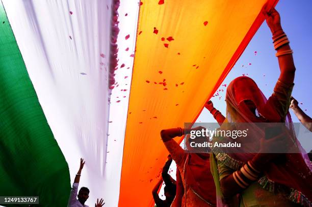 Indian People Hold 2100 - Feet Long Indian National flag at 'Tiranga Rally' on the occasion of Martyrs' Day, in Ajmer, Rajasthan, India on March 23,...