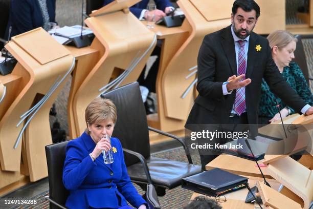 Leadership contender Humza Yousaf speaking during General Questions in the Scottish Parliament, as First Minister Nicola Sturgeon awaits the start of...