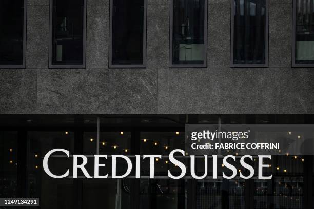 Sign of Credit Suisse bank is seen in Zurich, on March 23, 2023. - The marriage of UBS and Credit Suisse was hastily arranged to prevent a global...