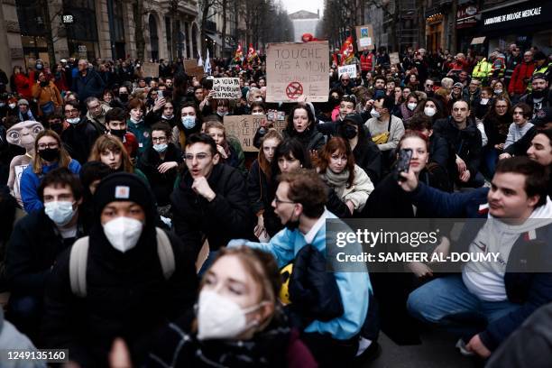 Protester holds a banner reading 'don't touch my journalist' during a demonstration, a week after the government pushed a pensions reform through...