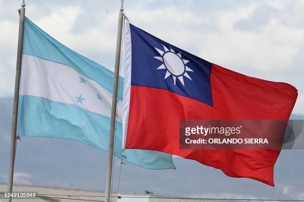 Honduras and Taiwan national flags fly at a square in Tegucigalpa on March 23, 2023. - Taiwan recalled on Thursday its ambassador to Honduras over a...