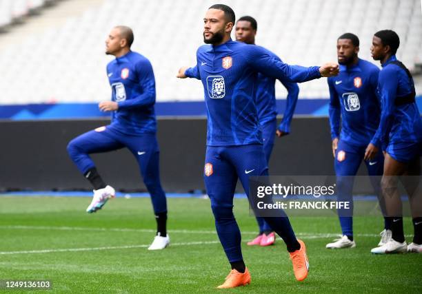 Netherlands' forward Memphis Depay takes part in a training session at the Stade de France in Saint-Denis, north of Paris on March 23 on the eve of...