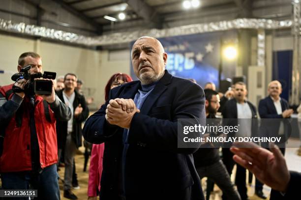 Head of the Bulgaria's center-right ruling GERB party and former Bulgaria's Prime Minister Boyko Borisov reacts as he is applauded during a...