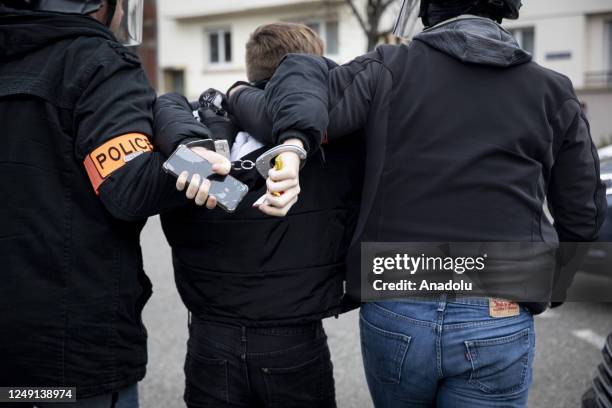 Police arrest a protestor a demonstration after the government pushed a pension reform through parliament without a vote, using the article 49.3 of...