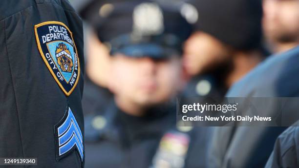 Sargent from the Detective Bureau instruct officers as they gather near the Manhattan Criminal Court early Tuesday due to the city increase security,...