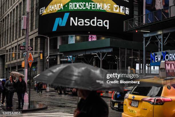 Signage outside the Nasdaq MarketSite in New York, US, on Thursday, March 23, 2023. Stocks struggled for direction as banks remained lower even after...