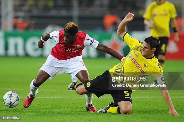 Alex Song of Arsenal and Sebastian Kehl of Dortmund battle for the ball during the UEFA Champions League Group F match between Borussia Dortmund and...