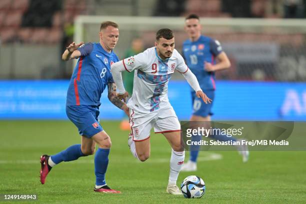 Danel Sinani of Luxembourg and Ondrej Duda of Slovakia in action during the UEFA EURO 2024 qualifying round group J match between Slovakia and...