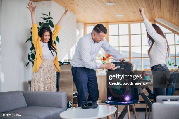 happy friends having fun together at home - music speaker stock pictures, royalty-free photos & images