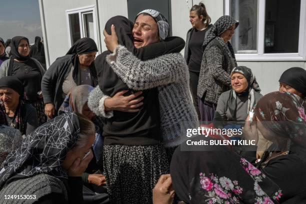 Women mourn their loved ones who died in a massive earthquake that struck southeast Turkey in early February, in Adiyaman, on March 23, 2023. - On...