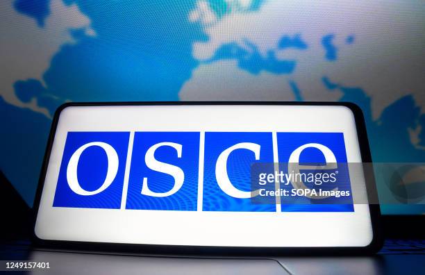 In this photo illustration, the Organization for Security and Co-operation in Europe logo seen displayed on a smartphone screen.