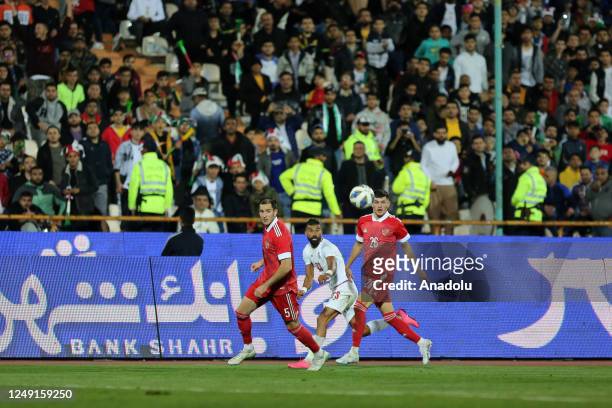 Konstantin Tyukavinortada and Daniil Hlusevic of Russia in action against Ramin Rezaeian of Iran during friendly match between Russia and Iran at...