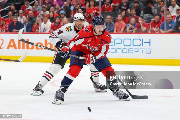 John Carlson of the Washington Capitals looks to take a shot on net during a game against the Chicago Blackhawks at Capital One Arena on March 23,...