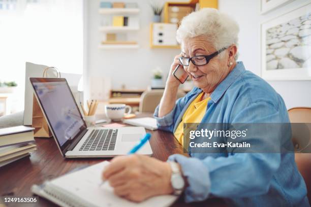 senior woman at home - silver surfer stock pictures, royalty-free photos & images