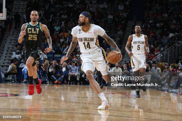 Brandon Ingram of the New Orleans Pelicans dribbles the ball during the game against the Charlotte Hornets on March 23, 2023 at the Smoothie King...