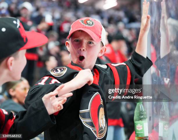 Fans cheer on the Ottawa Senators during the first period against the Tampa Bay Lightning at Canadian Tire Centre on March 23, 2023 in Ottawa,...