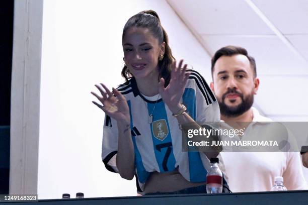 Argentinian singer and actress Martina Stoessel, known as Tini, greets the crowd during the friendly football match between Argentina and Panama at...