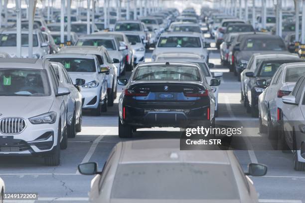 This photo taken on March 23, 2023 shows newly-produced cars at a BMW factory in Shenyang in China's northeastern Liaoning province. / China OUT /...
