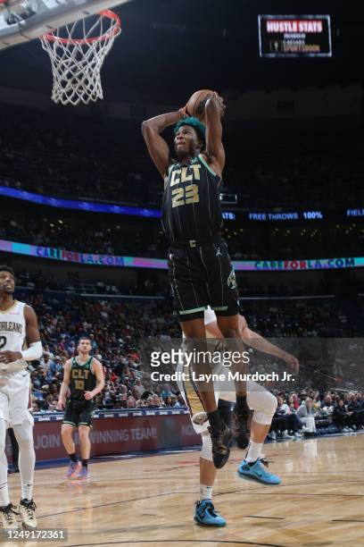 Kai Jones of the Charlotte Hornets drives to the basket during the game against the New Orleans Pelicans on March 23, 2023 at the Smoothie King...