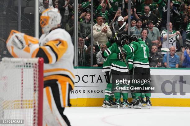 Colin Miller and Miro Heiskanen of the Dallas Stars celebrate a goal against the Pittsburgh Penguins at the American Airlines Center on March 23,...