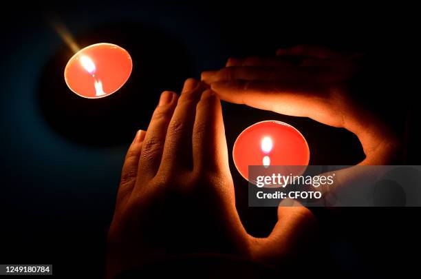 Primary school students place candles in Handan, North China's Hebei province, March 24, 2023. The theme of this year's Earth Hour is "Give an Hour...