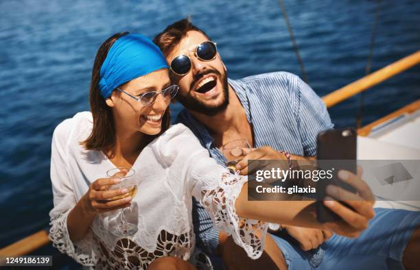 young couple on a sailing cruise. - luxury cruise ship stock pictures, royalty-free photos & images