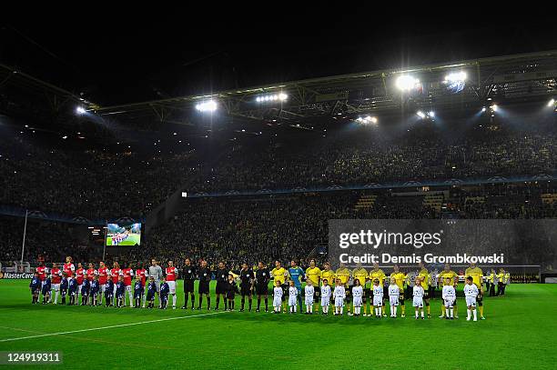 Teams line up during the Champions League anthem ahead of the UEFA Champions League Group F match between Borussia Dortmund and Arsenal FC at Signal...