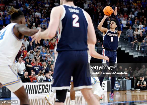 Julian Strawther of the Gonzaga Bulldogs attempts a three-point basket to take the lead during the second half against the UCLA Bruins in the Sweet...