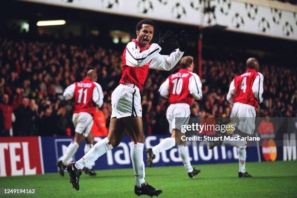 Thierry Henry celebrates scoring a goal during the UEFA Champions League Group D match between Arsenal and Bayer Laverkusen on February 27, 2002 in...