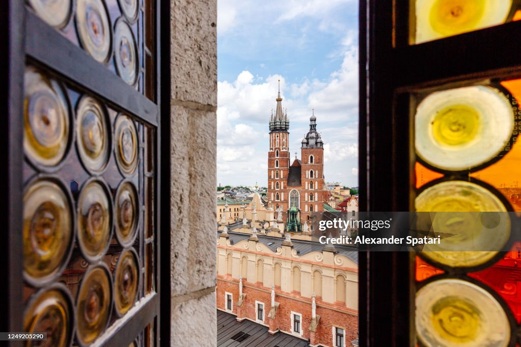 Krakow skyline with St Mary's Church seen through an open window, Poland