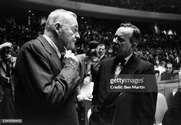 John Foster Dulles Secretary of State in Eisenhower administration conferring with Canadian Minister Lester Pearson in a United Nations Session, New...