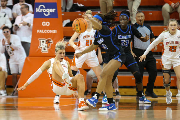 Bowling Green Falcons guard Elissa Brett tries to draw a charging call against Memphis Tigers guard Jamirah Shutes during a third round college...