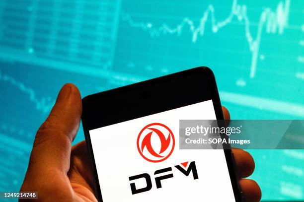 In this photo illustration, the Chinese state-owned automobile manufacturer Dongfeng Motor, also known as DFG, logo seen displayed on a smartphone...