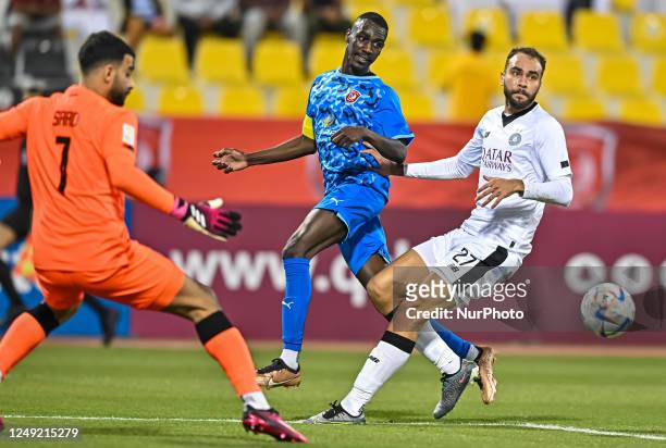 Bahaa Mamdouh Ellethy of Al Sadd SC and Mohammed Muntari of Al Duhail SC battle for the ball during the Ooredoo Cup semifinal between Al Duhail SC...