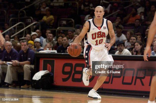 Mike Bibby of the USA handles the ball against the Puerto Rico Senior National Team on August 17, 2003 at Madison Square Garden in New York, New...