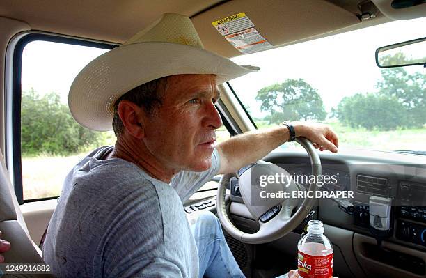 W. Bush Ranch US President George W. Bush drives his pickup truck 09 August 2002 at ...
