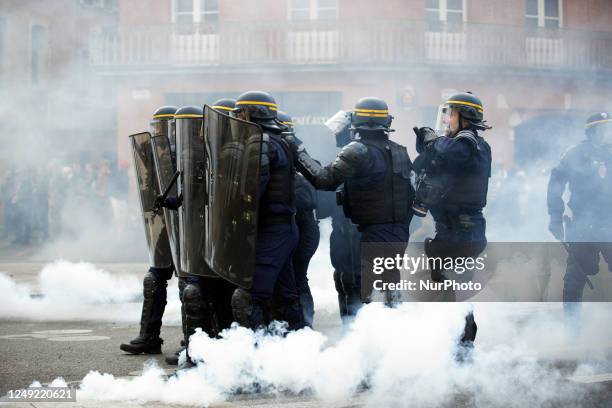 Riot policemen stands amid clouds of tear gas. Scuffles happened between protesters and riot police during the protest as people reacted with anger...