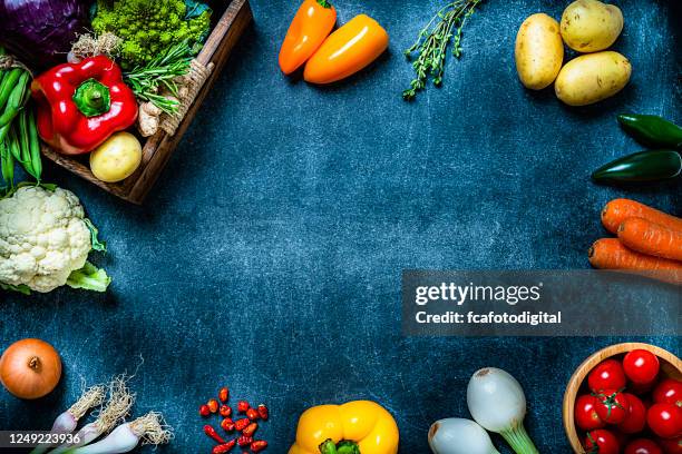 healthy fresh vegetables frame. copy space - food photography dark background blue stock pictures, royalty-free photos & images