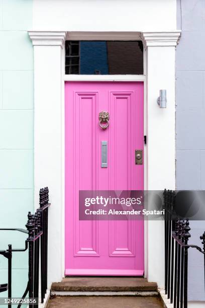 pink door on a residential building in london, uk. - notting hill london stock pictures, royalty-free photos & images