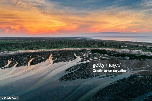 epic sunset and dramatic reflections the water - angola water stock pictures, royalty-free photos & images