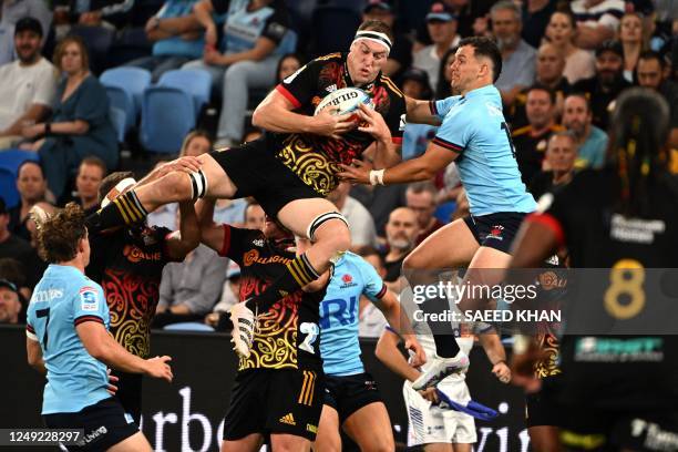 Chiefs' Brodie Retallick and Waratahs' Dylan Pietsch compete for the ball during the Super Rugby match between the New South Wales Waratahs and...