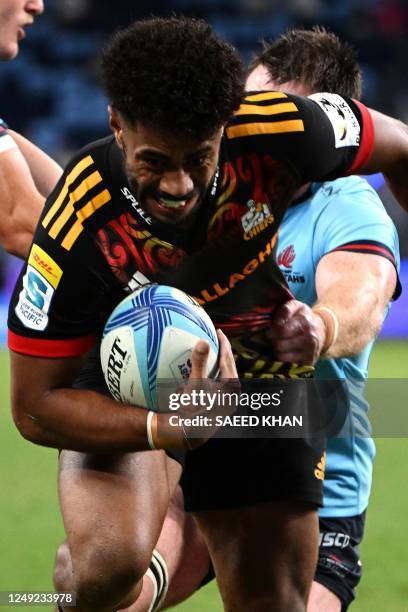 Chiefs' Emoji Narawa runs with the ball during the Super Rugby match between the New South Wales Waratahs and Chiefs at the Allianz Stadium in Sydney...