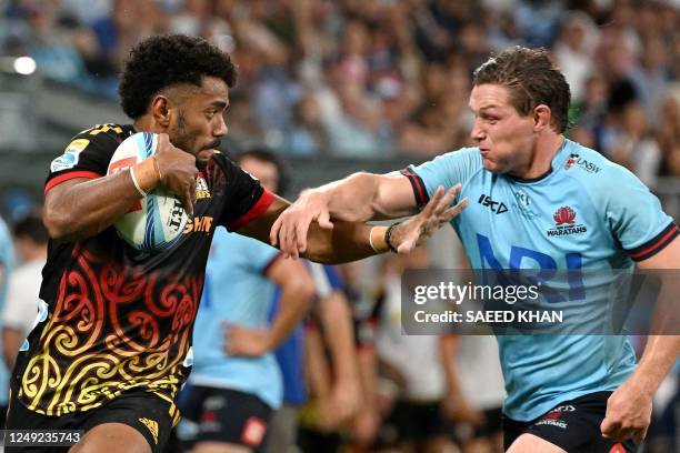 Chiefs' Emoji Narawa avoids a tackle by Waratahs' Michael Hooper during the Super Rugby match between the New South Wales Waratahs and Chiefs at the...