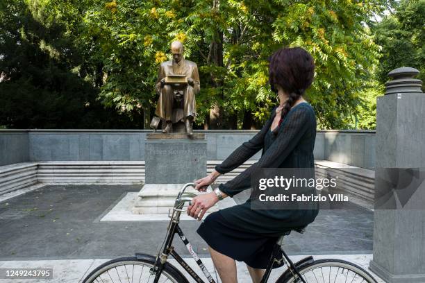 Young woman in front of the statue of the journalist Indro Montanelli, in the park named after him, on June 12, 2020 in Milan, Italy. Following the...